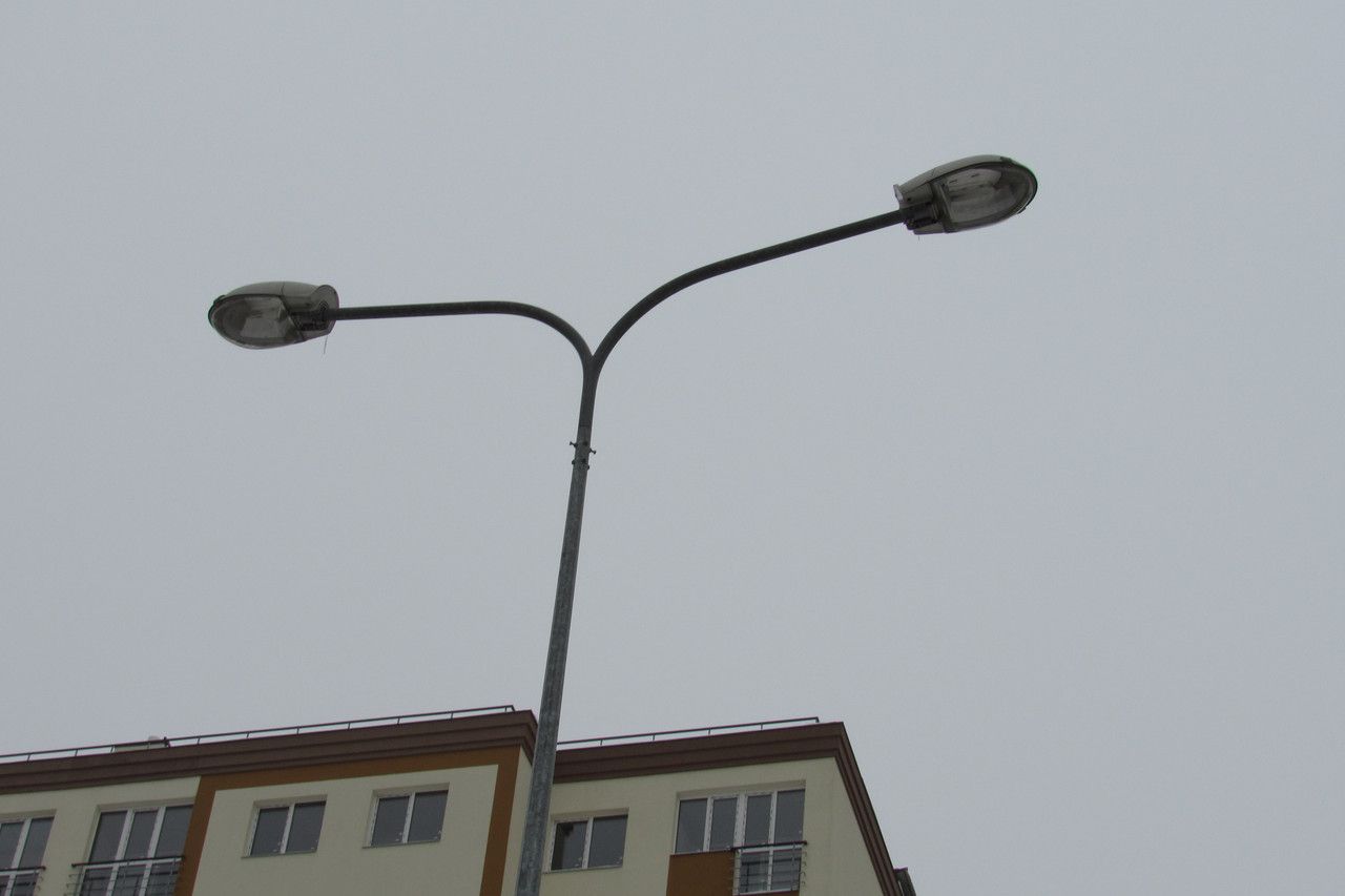 Double-arm bracket for lighting poles (designed for mounting two luminaires).