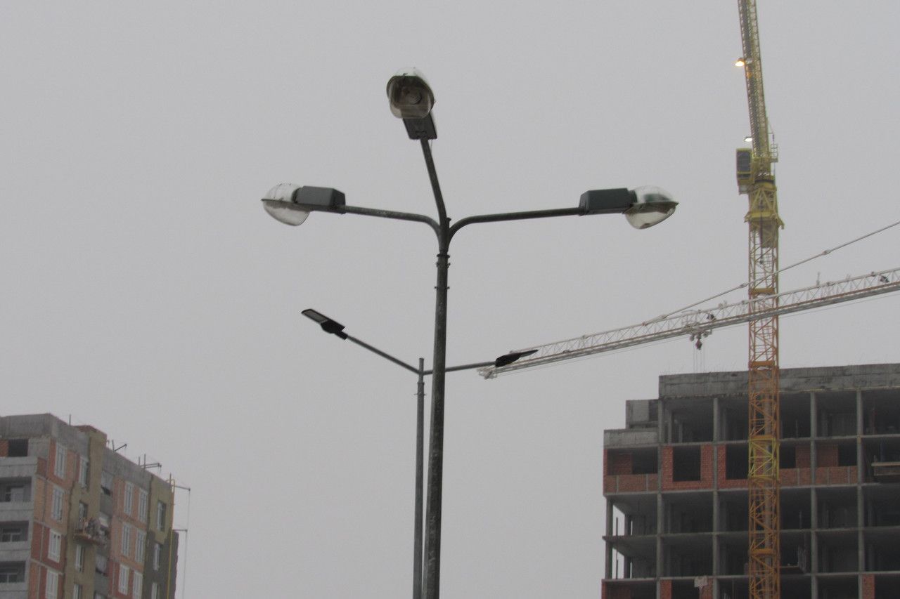 Double-arm bracket for lighting poles (designed for mounting two luminaires).