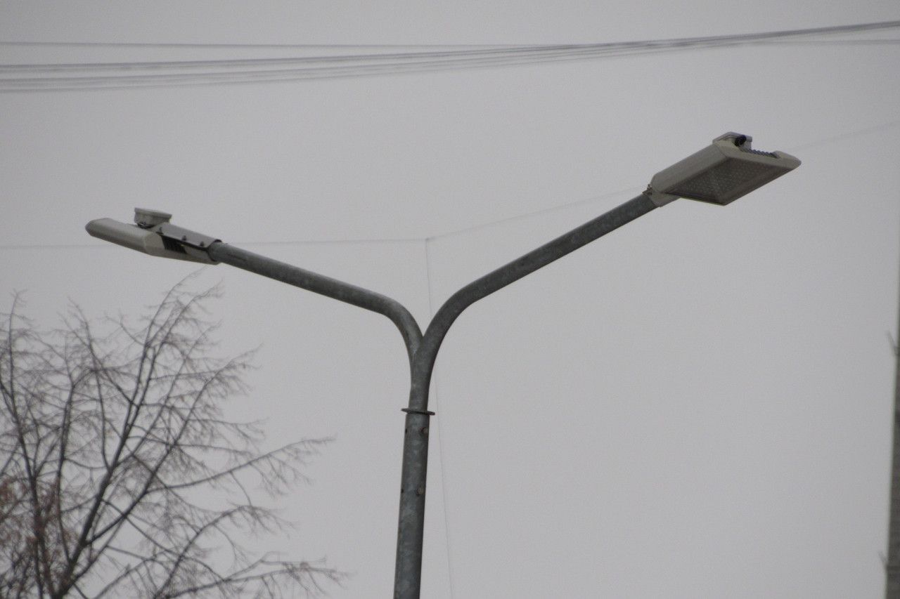 Double-arm bracket for lighting poles (designed for mounting two luminaires).